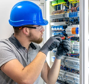 Field Engineer technician installing network cabling in data center